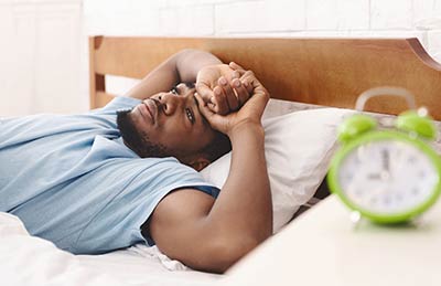 man staying awake from sleep apnea