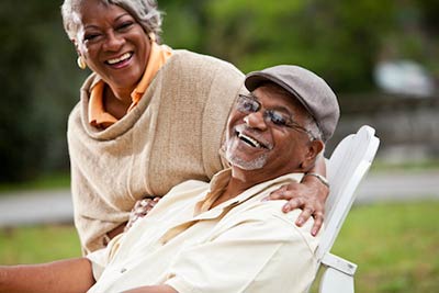 couple smiling after restorative dentistry procedure